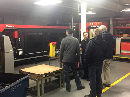 A tour group in the Laser Cutting Center